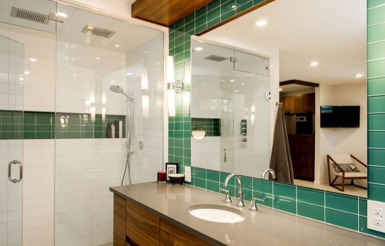 Modwalls Lush Glass Subway Tile | 3x6 in Peacock | Blue | Pictured installed on a bathroom wall | Colorful Modern glass tile for bathrooms, showers, kitchen, backsplashes, pools & outdoors.