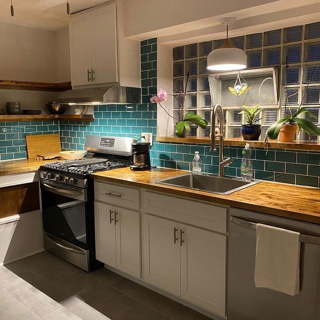 Modwalls Lush Glass Subway Tile | 3x6 in Peacock | Blue | Pictured installed on a kitchen backsplash| Colorful Modern glass tile for bathrooms, showers, kitchen, backsplashes, pools & outdoors.