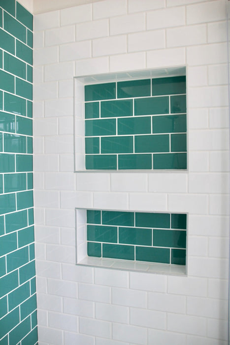 Modwalls Lush Glass Subway Tile | 3x6 in Peacock | Blue | Pictured installed in a shower | Colorful Modern glass tile for bathrooms, showers, kitchen, backsplashes, pools & outdoors.