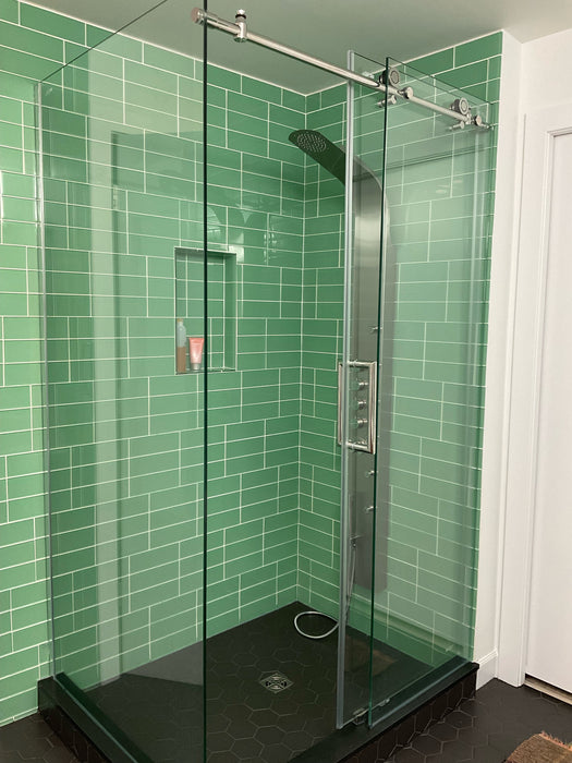 Modwalls Lush Glass Subway Tile | 3x9 in Rainforest | Green | Pictured installed in a shower | Colorful Modern glass tile for bathrooms, showers, kitchen, backsplashes, pools & outdoors.