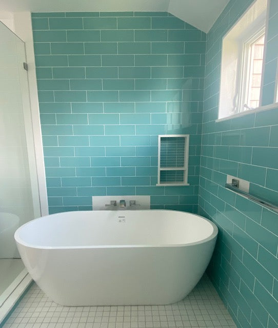 Modwalls Lush Glass Subway Tile | 4x12 in Breaker | Blue | Pictured installed on a bathroom wall | Colorful Modern glass tile for bathrooms, showers, kitchen, backsplashes, pools & outdoors.