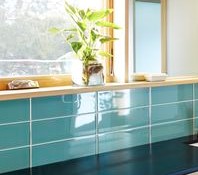 Modwalls Lush Glass Subway Tile | 4x12 in Breaker | Blue | Pictured installed on a kitchen backsplash | Colorful Modern glass tile for bathrooms, showers, kitchen, backsplashes, pools & outdoors.
