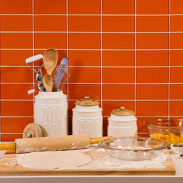 Modwalls Lush Glass Subway Tile | 3x6 in Poppy | Orange | Pictured installed on a kitchen backsplash | Colorful Modern glass tile for bathrooms, showers, kitchen, backsplashes, pools & outdoors.