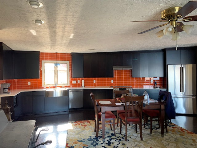 Modwalls Lush Glass Subway Tile | 3x6 in Poppy | Orange | Pictured installed on a kitchen backsplash  | Colorful Modern glass tile for bathrooms, showers, kitchen, backsplashes, pools & outdoors.