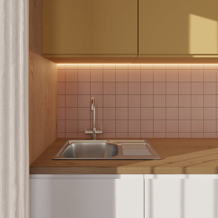 Modwalls Lush Glass Subway Tile | 4x4 in Afterglow Pink | Pictured installed on a kitchen backsplash | Colorful Modern glass tile for bathrooms, showers, kitchen, backsplashes, pools & outdoors.