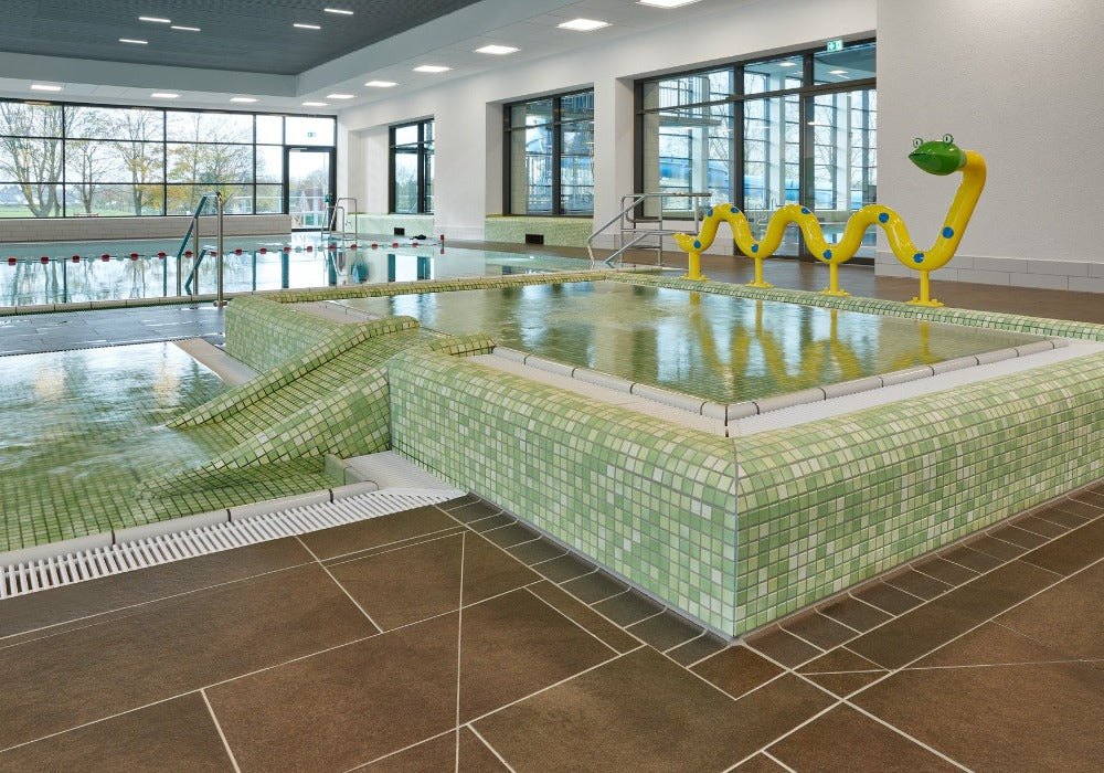 Modwalls Mediterranean Mosaic Porcelain Tile | Provence Blend Matte | Green | Pictured installed in a pool surround | Colorful Modern & Midcentury tile for bathrooms, kitchens, backsplashes, showers, floors, pools & outdoors.