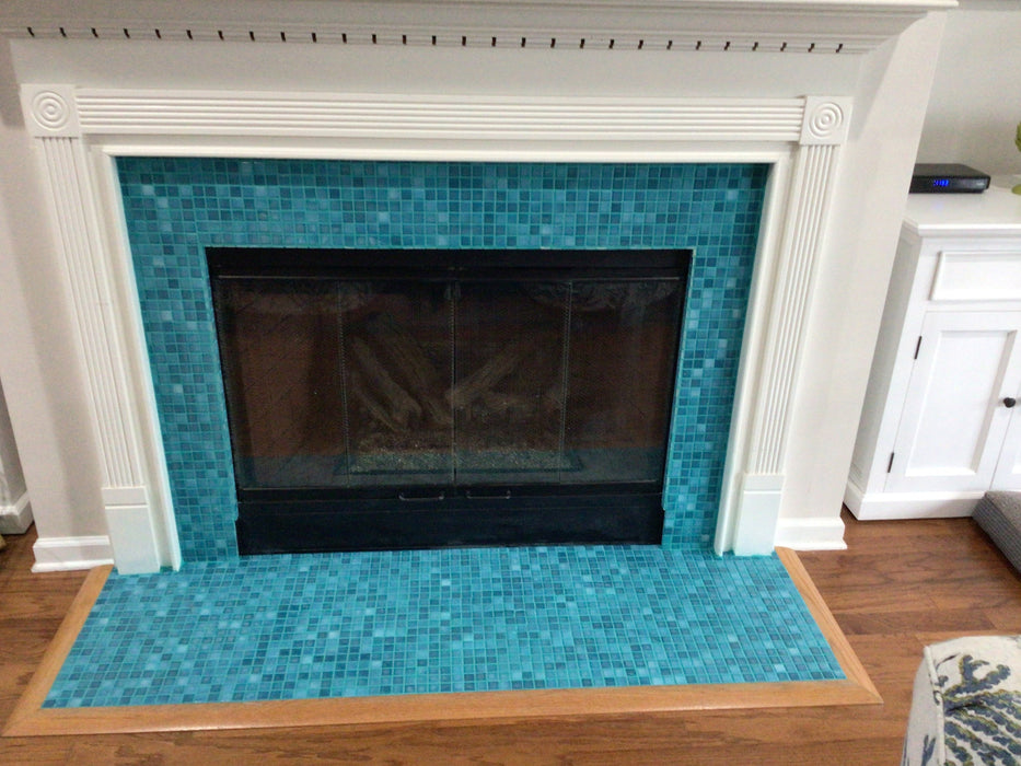 Modwalls Mediterranean Mosaic Porcelain Tile | San Tropez Blend Gloss | Blue | Pictured installed on a fireplace | Colorful Modern & Midcentury tile for bathrooms, kitchens, backsplashes, showers, floors, pools & outdoors.