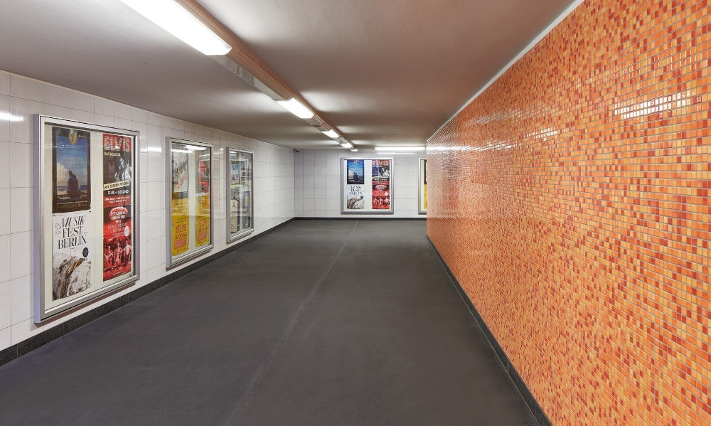 Modwalls Mediterranean Mosaic Porcelain Tile | Valencia Blend Gloss | Orange | Pictured installed on a large commercial project in a transit center | Colorful Modern & Midcentury tile for bathrooms, kitchens, backsplashes, showers, floors, pools & outdoors.