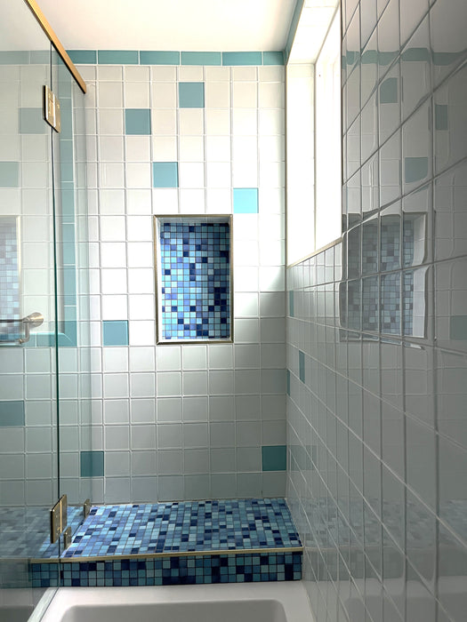Modwalls Mediterranean Mosaic Porcelain Tile | Cannes Blend Gloss | Blue | Pictured on a shower floor and feature area | Colorful Modern & Midcentury tile for bathrooms, kitchens, backsplashes, showers, floors, pools & outdoors.