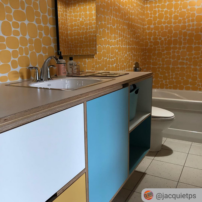 Modwalls Rex Ray Studio Rox Ceramic Tile | Solar | Yellow | Installed on bathroom walls | Colorful Modern & Midcentury tile for interior walls, bathrooms, kitchens, backsplashes, showers.