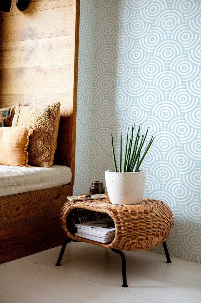 Modwalls ModPaper | ModSwirl | Light blue swirling repeating wallpaper design | Pictured installed in a living room | Colorful Midcentury and Retro wallpapers for bathrooms, kitchens, living rooms, dining rooms, baby rooms, kid’s rooms, and offices.