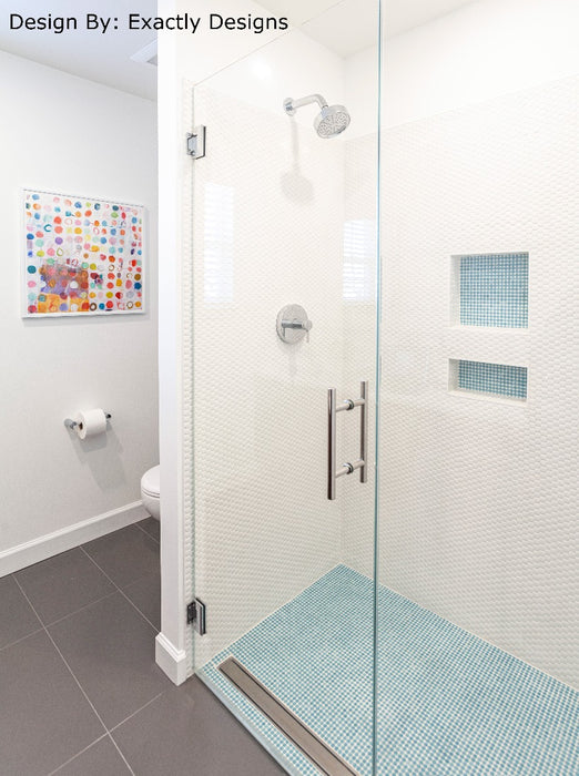 Modwalls PopDotz Porcelain Penny Round Tile | 1” Gloss | Sno-Drop Blend | White | Pictured installed in a bathroom shower | Colorful Modern & Midcentury tile for bathrooms, kitchens, backsplashes, showers, floors, pools & outdoors.