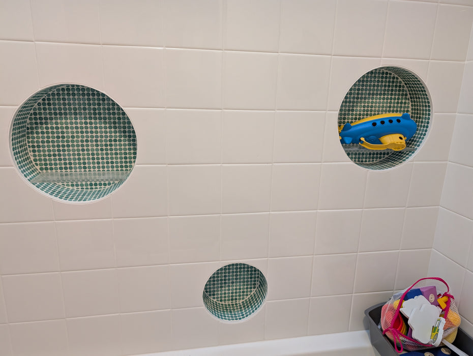 Modwalls PopDotz Porcelain Penny Round Tile | 1” Gloss | Spearmint Blend | Green | Pictured installed in a bathroom shower | Colorful Modern & Midcentury tile for bathrooms, kitchens, backsplashes, showers, floors, pools & outdoors.