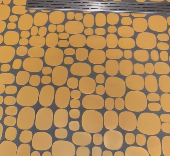 Modwalls Rex Ray Studio Rox Ceramic Tile | Solar | Yellow | Installed on bathroom walls | Colorful Modern & Midcentury tile for interior walls, bathrooms, kitchens, backsplashes, showers.