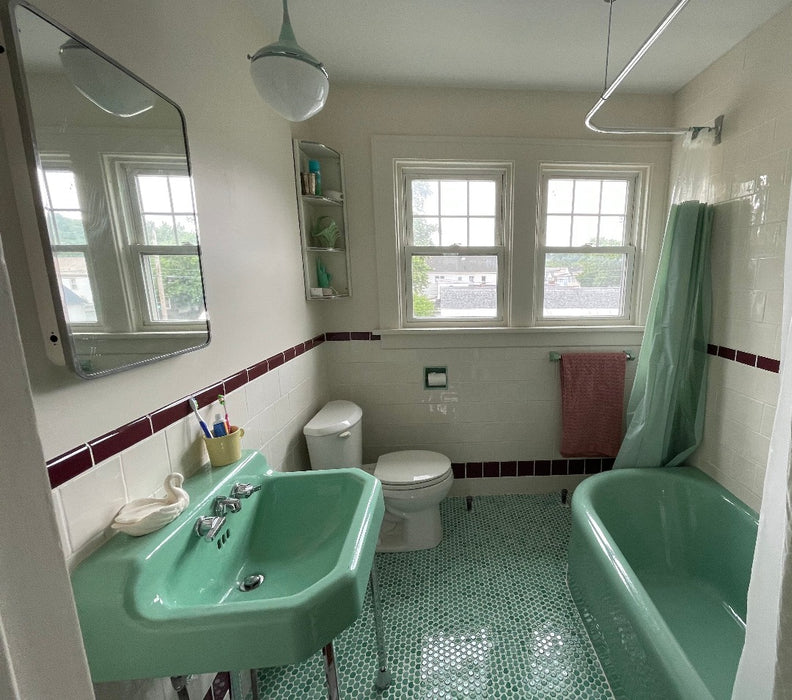 Modwalls PopDotz Porcelain Penny Round Tile | 1” Gloss | Spearmint Blend | Green | Pictured installed on a bathroom floor | Colorful Modern & Midcentury tile for bathrooms, kitchens, backsplashes, showers, floors, pools & outdoors.