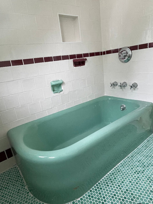 Modwalls PopDotz Porcelain Penny Round Tile | 1” Gloss | Spearmint Blend | Green | Pictured installed on a bathroom floor |  Colorful Modern & Midcentury tile for bathrooms, kitchens, backsplashes, showers, floors, pools & outdoors.