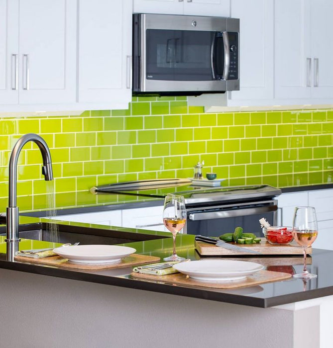 Modwalls Lush Glass Subway Tile | 3x6 in Lemongrass | Green | Pictured installed on a kitchen backsplash | Colorful Modern glass tile for bathrooms, showers, kitchen, backsplashes, pools & outdoors.