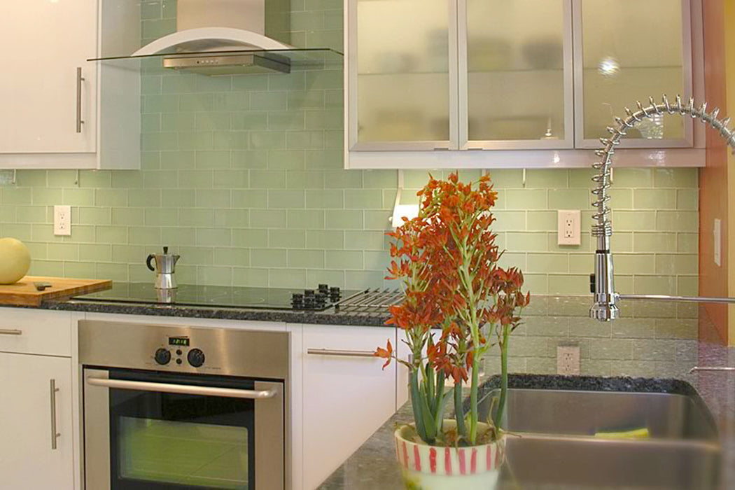Modwalls Lush Glass Subway Tile | 3x6 in Surf | Green | Pictured installed on a kitchen backsplash | Colorful Modern glass tile for bathrooms, showers, kitchen, backsplashes, pools & outdoors.