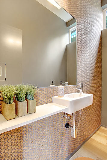 Modwalls CorkDotz Small Cork Penny Round Tile | Round Tile | Brown | Pictured installed on a bathroom wall | Modern tile for backsplashes, kitchens, bathrooms, showers, pools, outdoor and floors