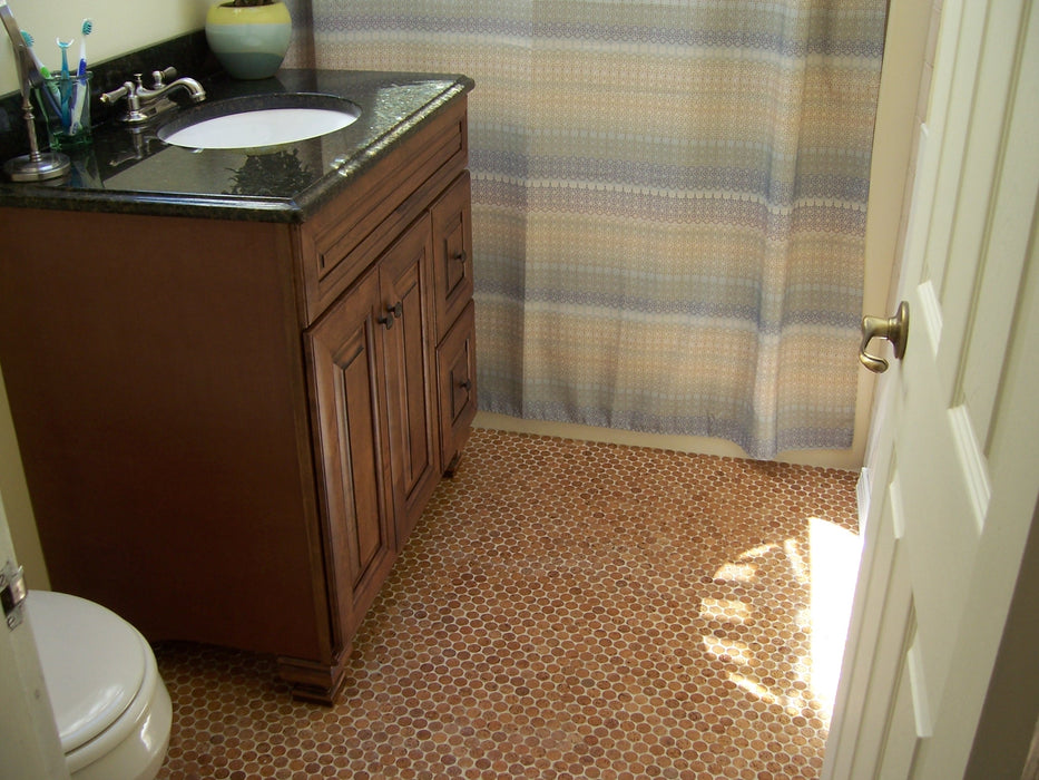 Modwalls CorkDotz Small Cork Penny Round Tile | Round Tile | Brown | Pictured  installed on a bathroom floor | Modern and eco-friendly tile for kitchens, backsplashes, bathrooms & floors.