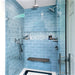 Handmade 3x8 subway tiles in a light blue we like to call hydrangea, installed floor to ceiling in a shower with a custom small hex mosaic inset. This beautiful tile is great for kitchens, backsplashes, bathrooms and showers and is available in 105 unique colors