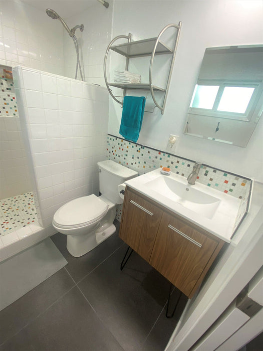 Modwalls Brio Glass Mosaic Tile | Atomic Blend | Pictured in a bathroom installation | Colorful Modern & Midcentury glass tile for kitchens, bathrooms, backsplashes, showers, pools & outdoors.
