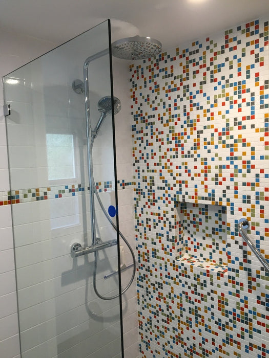 Modwalls Brio Glass Mosaic Tile | Logo Blend | Pictured in a shower | Colorful Modern & Midcentury glass tile for kitchens, bathrooms, backsplashes, showers, pools & outdoors.