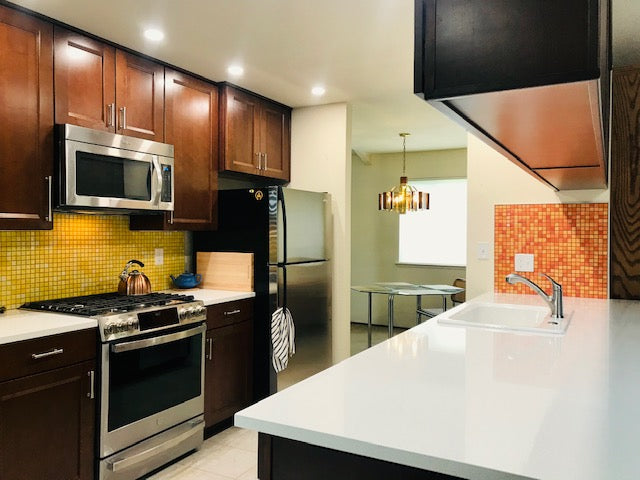Modwalls Mediterranean Mosaic Porcelain Tile | Valencia Blend Gloss | Orange | Pictured installed on a kitchen backsplash | Colorful Modern & Midcentury tile for bathrooms, kitchens, backsplashes, showers, floors, pools & outdoors.