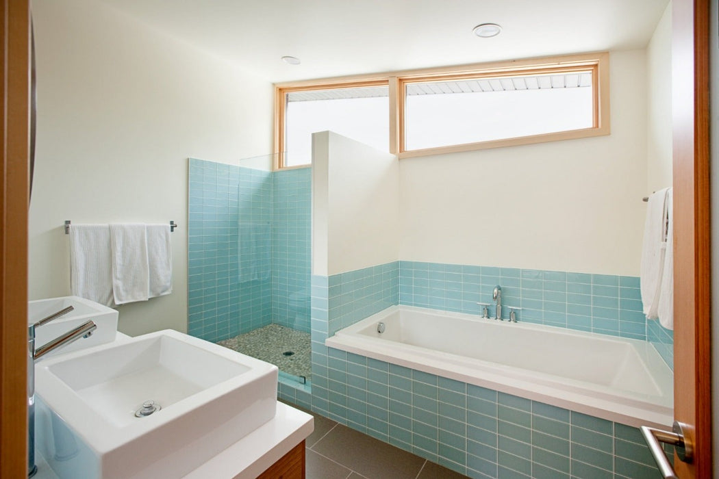 Modwalls Lush Glass Subway Tile | 3x6 in Vapor | Blue | Pictured installed in a shower | Colorful Modern glass tile for bathrooms, showers, kitchen, backsplashes, pools & outdoors.