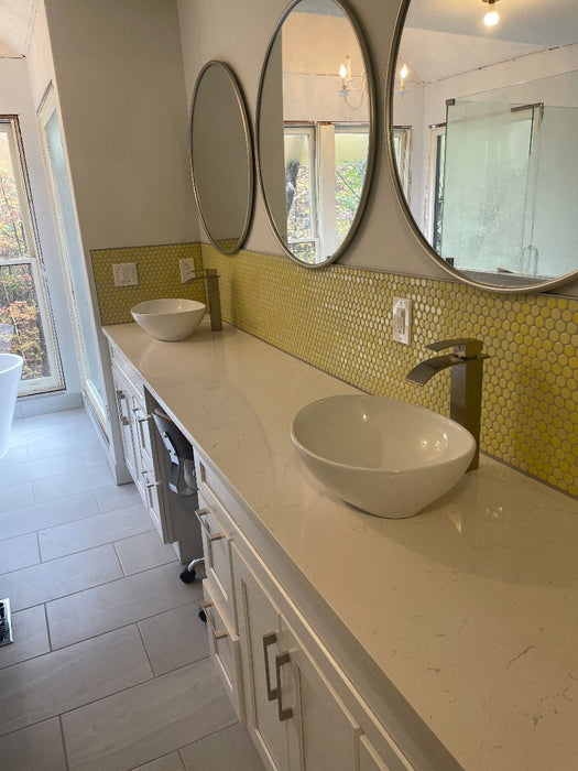 Modwalls PopDotz Porcelain Penny Round Tile | Lemon Drop Blend | Yellow | Pictured installed on a bathroom vanity wall |  Colorful Modern & Midcentury tile for bathrooms, kitchens, backsplashes, showers, floors, pools & outdoors.