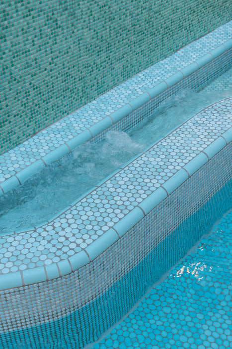 Modwalls PopDotz Porcelain Penny Round Tile | 1” Gloss | Taffy Blend | Blue | Pictured installed in a pool | Colorful Modern & Midcentury tile for bathrooms, kitchens, backsplashes, showers, floors, pools & outdoors.