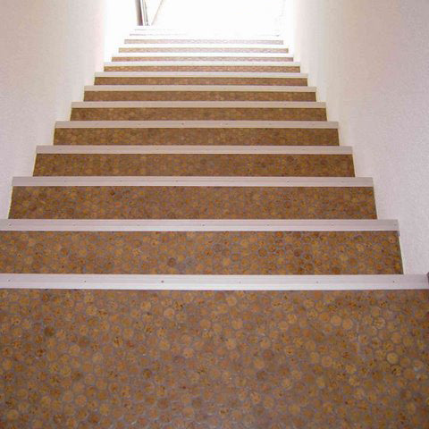 Modwalls CorkDotz Small Cork Penny Round Tile | Round Tile | Brown | Pictured installed on a flight of stairs | Modern and eco-friendly tile for kitchens, backsplashes, bathrooms & floors.