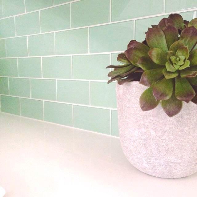 Modwalls Lush Glass Subway Tile | 3x6 in Surf | Green | Pictured installed on a kitchen backsplash | Colorful Modern glass tile for bathrooms, showers, kitchen, backsplashes, pools & outdoors.