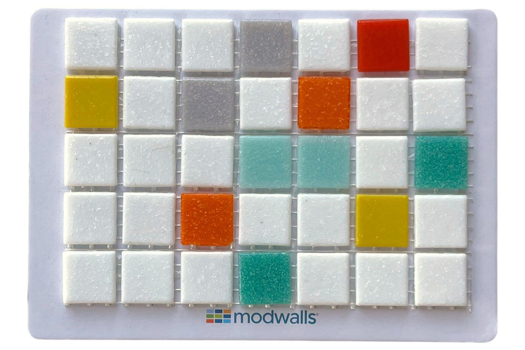 A square sample card displaying multiple small square wall tiles in white, gray, yellow, orange, red, and teal, with the brand name 'modwalls' printed at the bottom.