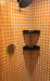 Modwalls ColorBlock 2 Porcelain Tile | Marmalade | Orange | Pictured on the walls of a shower | Colorful Modern & Midcentury tile for bathrooms, kitchens, backsplashes, showers, floors, pools & outdoors. 