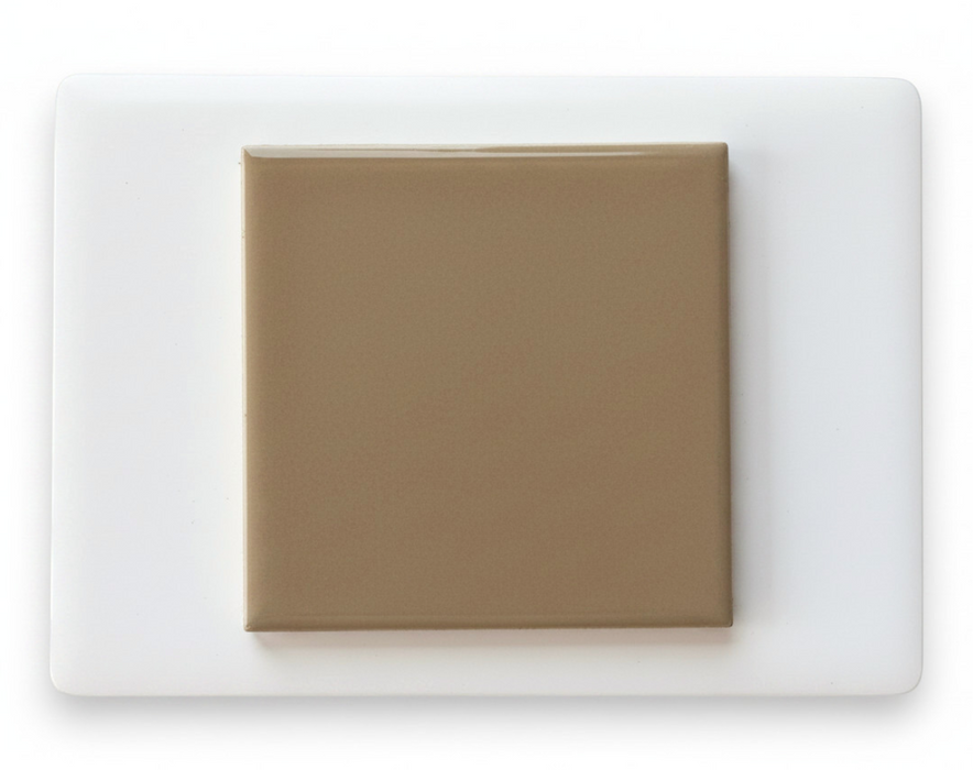 Modwalls Element Porcelain Tile Sample | Camel |Pictured mounted on white board | 4x4 gloss | Colorful modern tile suitable for indoor, outdoor, floor, wall, wet or dry. This tile is perfect for backsplashes, kitchens, bathrooms, showers, feature areas and commercial projects.