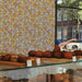 Modwalls ModPaper | ModSpring | Purple, green, blue and pink repeating wallpaper design | Pictured installed in a bakery | Colorful Midcentury and Retro wallpapers for bathrooms, kitchens, living rooms, dining rooms, baby rooms, kid’s rooms, and offices. 