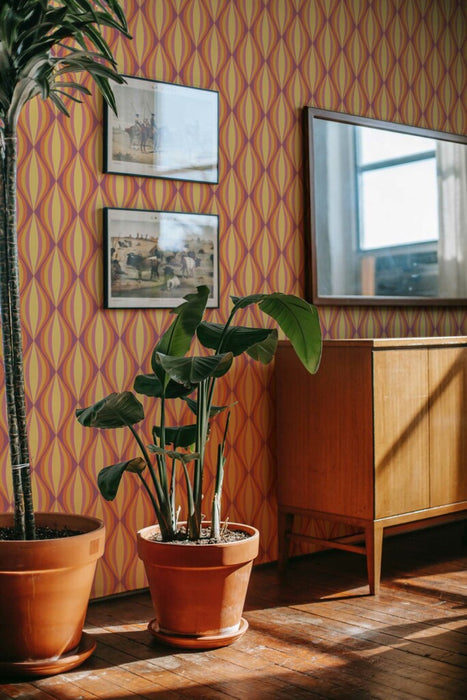 Modwalls ModPaper | ModTwist | Orange and purple oval repeating wallpaper design | Pictured installed in a living room | Colorful Midcentury and Retro wallpapers for bathrooms, kitchens, living rooms, dining rooms, baby rooms, kid’s rooms, and offices. 