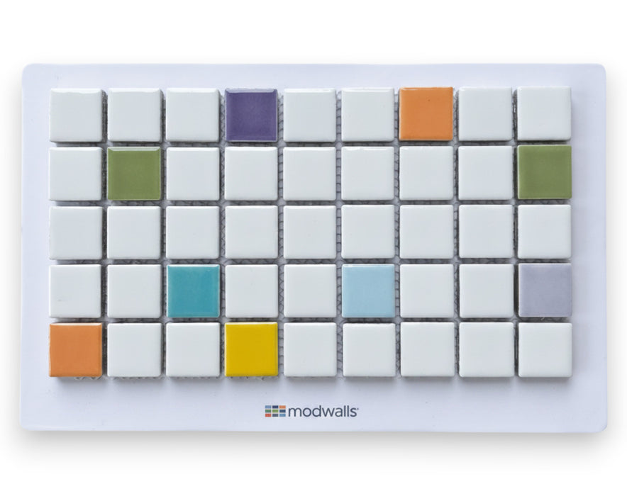 Modwalls Vita Blend Sample  | Cosmo Blend | White, orange, teal, light blue, lime green, green, yellow, lavender and purple tiles | 1x1 gloss mosaic porcelain blends | Pictured mounted on a white board | Choose your pattern colors from 58 color choices. This image depicts a diagram of the colors of the custom pattern. Colorful tile suitable for indoor, outdoor, floor, wall, wet or dry. This tile is perfect for backsplashes, kitchens, bathrooms, showers, feature areas and commercial projects. 